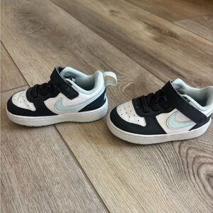 Nike Kids Black and White Sneakers with Blue Swoosh